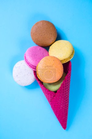 Photo for Colorful macaroons in ice cream cone - Royalty Free Image