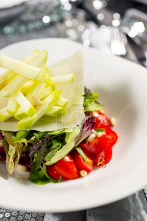 Photo for Tomato and apple salad on plate - Royalty Free Image