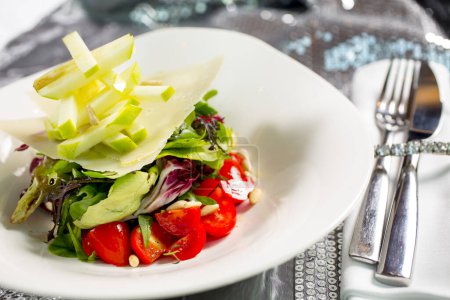 Photo for Tomato and apple salad on plate - Royalty Free Image