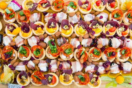 Photo for Small canapes on wooden board - Royalty Free Image