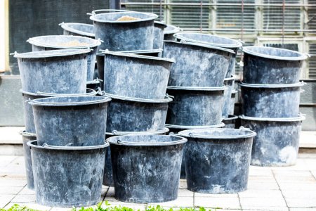 Photo for Black plastic buckets on a pile - Royalty Free Image