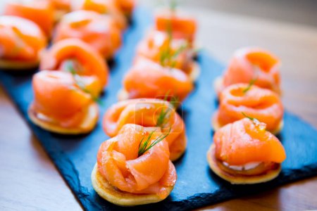 Photo for Fresh salmon canapes on table - Royalty Free Image