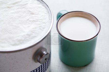 Photo for Boiled milk in bowl and cup - Royalty Free Image