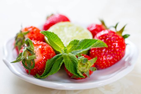Photo for Fresh strawberries, lime and mint isolated - Royalty Free Image