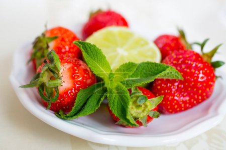 Photo for Fresh strawberries, lime and mint isolated - Royalty Free Image