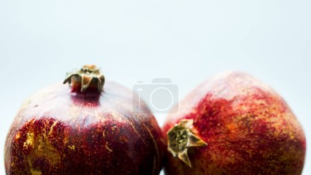 Photo for Pomegranates on rustic wooden background - Royalty Free Image
