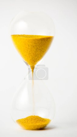 Photo for Hourglass with gold beads on white background - Royalty Free Image