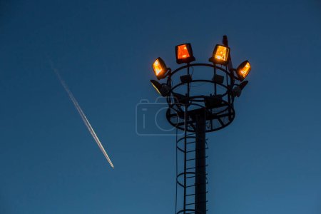 Photo for Stadium spotlights on blue sky background - Royalty Free Image