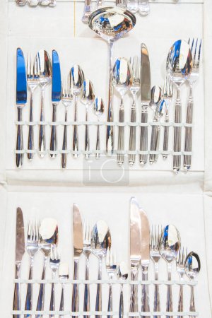 Photo for Spoons, knives and forks in a line - Royalty Free Image
