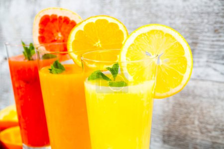 Photo for Freshly squeezed orange, lemon and grapefruit juices - Royalty Free Image