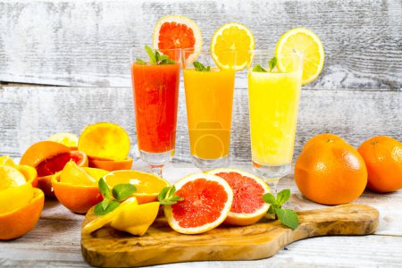 Photo for Freshly squeezed orange, lemon and grapefruit juices - Royalty Free Image