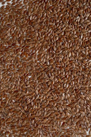 Téléchargez les photos : Graines de lin brun gros plan - en image libre de droit