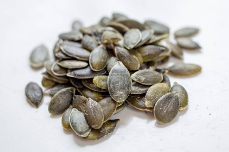 Photo for Pumpkin or sunflower seeds on white background - Royalty Free Image