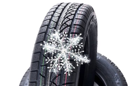 Photo for Winter tyre and snowflake on white background - Royalty Free Image
