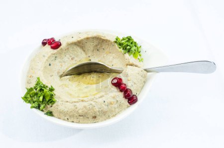 Photo for Hummus wuth spoon on white background - Royalty Free Image