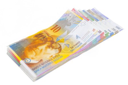 Téléchargez les photos : Francs suisses couchés sur un fond blanc - en image libre de droit