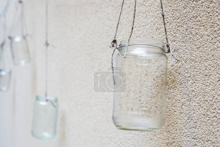 Photo for Decorative empty jars on wall - Royalty Free Image