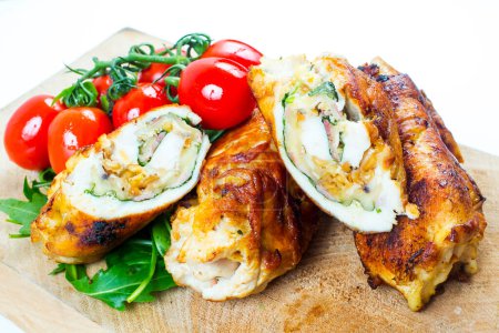 Photo for Rolled chicken. Stuffed chicken fillet with vegetables - Royalty Free Image