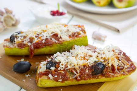 Photo for Zucchini stuffed with meat, tomato and cheese - Royalty Free Image