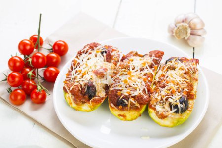 Photo for Zucchini stuffed with meat, tomato and cheese - Royalty Free Image