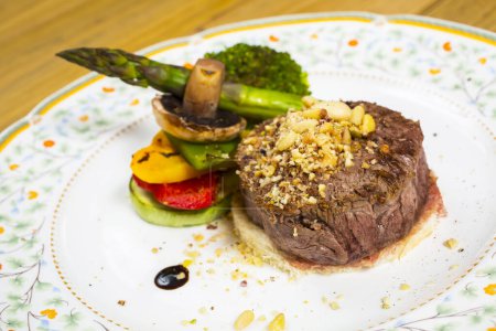 Photo for Steak with boiled vegetables on plate - Royalty Free Image