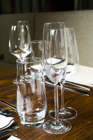 Photo for Empty glasses on the wooden table - Royalty Free Image