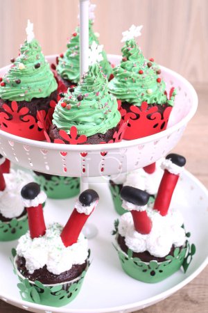 Photo for Christmas cupcakes in form of Christmas trees - Royalty Free Image