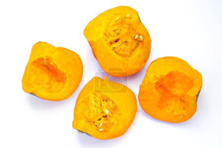 Photo for Cut a pieces of ripe pumpkin on a white background - Royalty Free Image