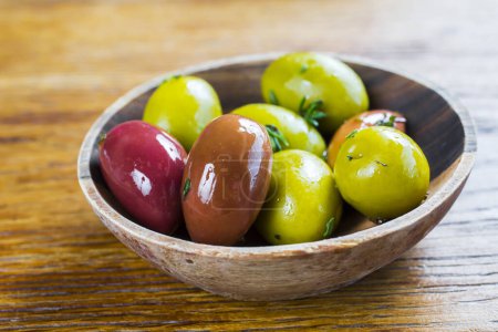 Photo for Different olive fruits on wooden background - Royalty Free Image