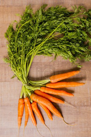 Photo for Fresh carrots on wooden background - Royalty Free Image