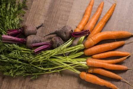 Photo for Fresh vegetables carrots, beetroots on wooden background. Harvest still life - Royalty Free Image