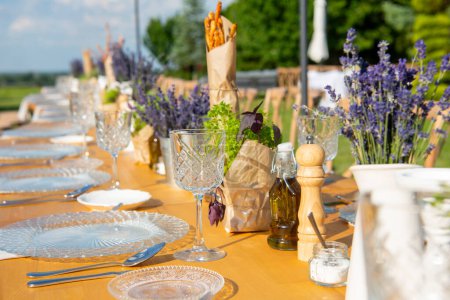 Photo for Beautifully arranged celebration table with lavenders - Royalty Free Image