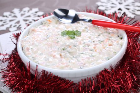 Photo for Russian traditional salad olivie. Salad with chopped vegetables and mayonnaise. Russian salad - Royalty Free Image