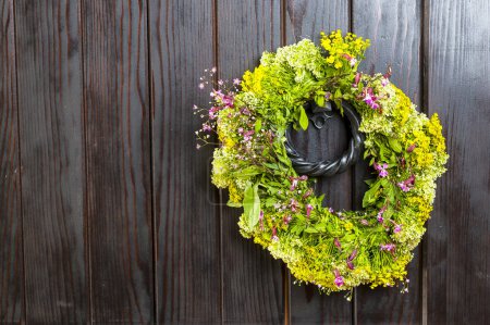 Photo for Flower wreath isolated on vintage wooden background - Royalty Free Image