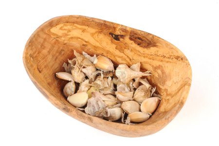Photo for Garlic in a bowl of olive wood - Royalty Free Image