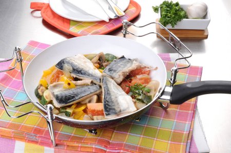 Photo for Fillet of sea bass with vegetables in a pan - Royalty Free Image