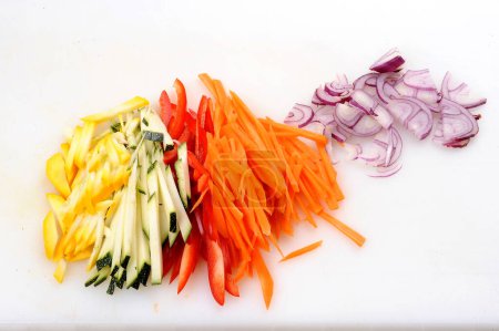 Photo for Bright fresh vegetables cut up slices - Royalty Free Image