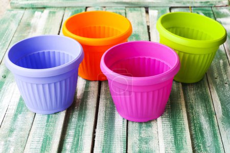 Photo for Colorful plastic flower pots - Royalty Free Image