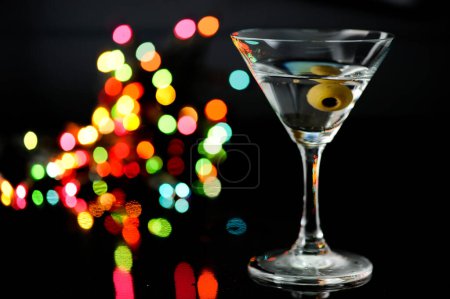 Photo for Glasses of cocktails martini with green olives on bar. - Royalty Free Image