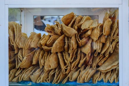Photo for Golden tacos at a street food stand in Mexico. Typical Mexican food. - Royalty Free Image
