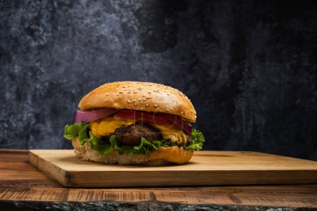 Photo for Homemade hamburger on a wooden table. - Royalty Free Image