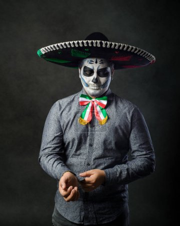 Photo for Portrait of a catrin wearing a charro hat. Typical Mexican character. Day of the dead and Halloween make up. - Royalty Free Image
