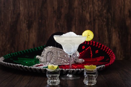 Photo for Margarita cocktail and mariachi hat in the background. Mexican symbols. - Royalty Free Image