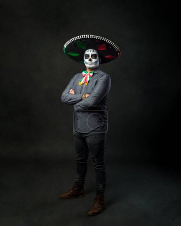 Photo for Portrait of a catrin wearing a charro hat. Typical Mexican character. Day of the dead and Halloween make up. - Royalty Free Image