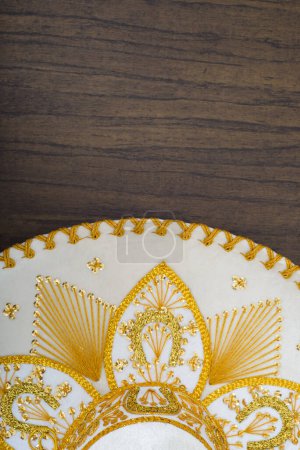 Photo for Mexican charro hat on wooden table. Mariachi hat. Typical mexican sombrero. - Royalty Free Image