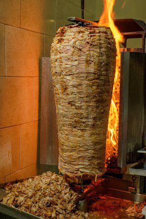 Meat trompo for tacos al pastor. Mexican street food. Marinated meat al pastor.