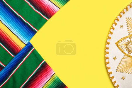 Photo for Mariachi hat and serape on yellow background. Mexican independence concept. Cinco de mayo background. - Royalty Free Image