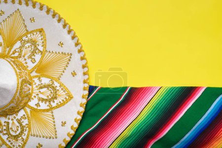 Photo for Mariachi hat and serape on yellow background. Mexican independence concept. Cinco de mayo background. - Royalty Free Image