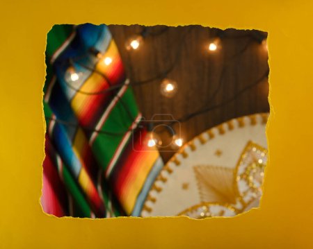Photo for Torn paper frame in front of festive mexican background. Cinco de mayo and independence day celebration. - Royalty Free Image