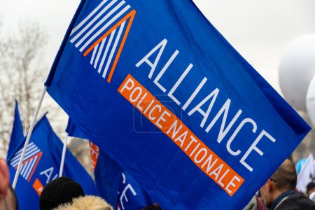 Photo for Paris, France - January 19, 2023: Logo of the French trade union organization Alliance Police Nationale printed on a blue flag shot close-up during a protest - Royalty Free Image